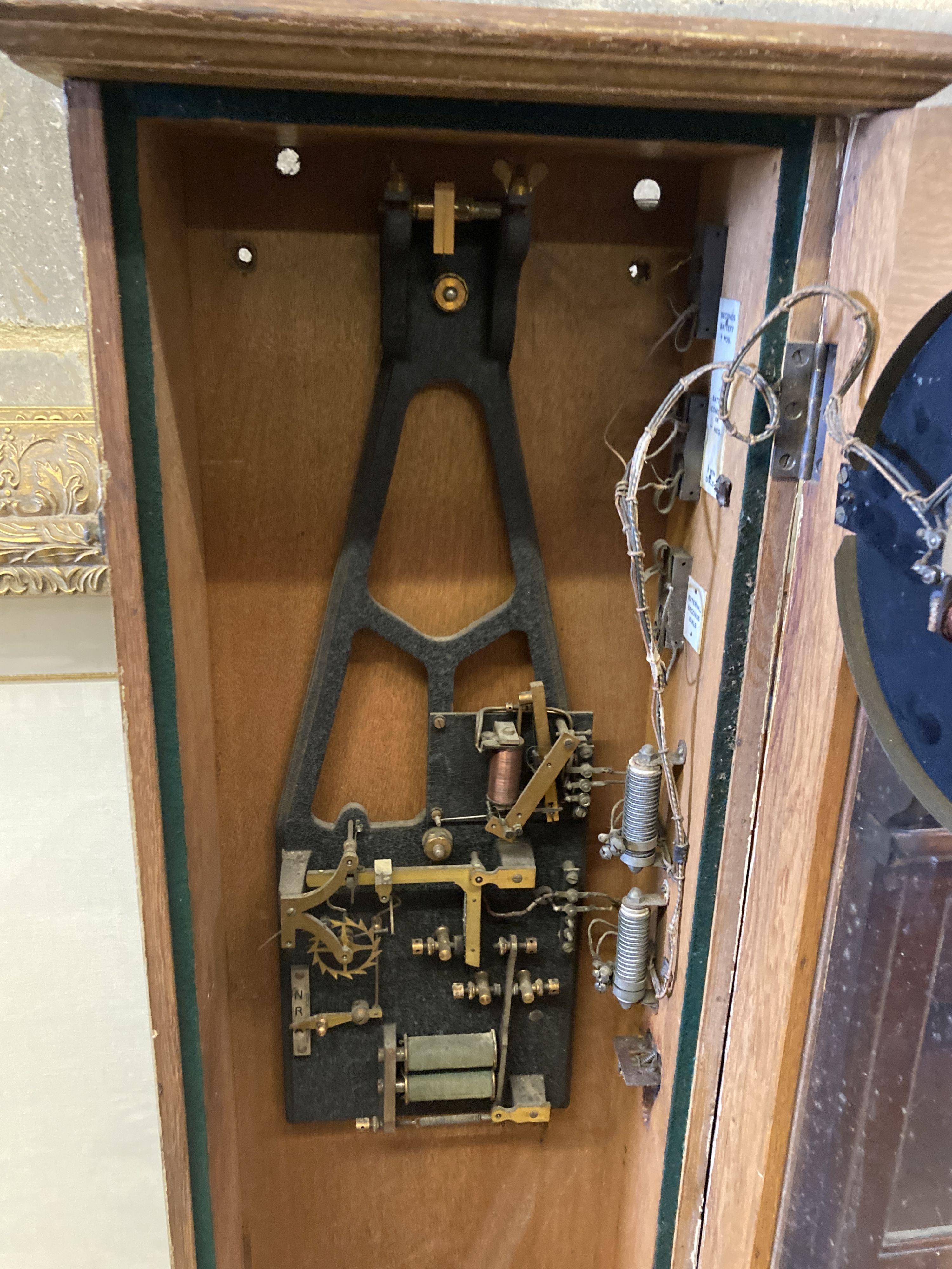 A Synchronome electric oak cased pendulum master clock, height 128cm